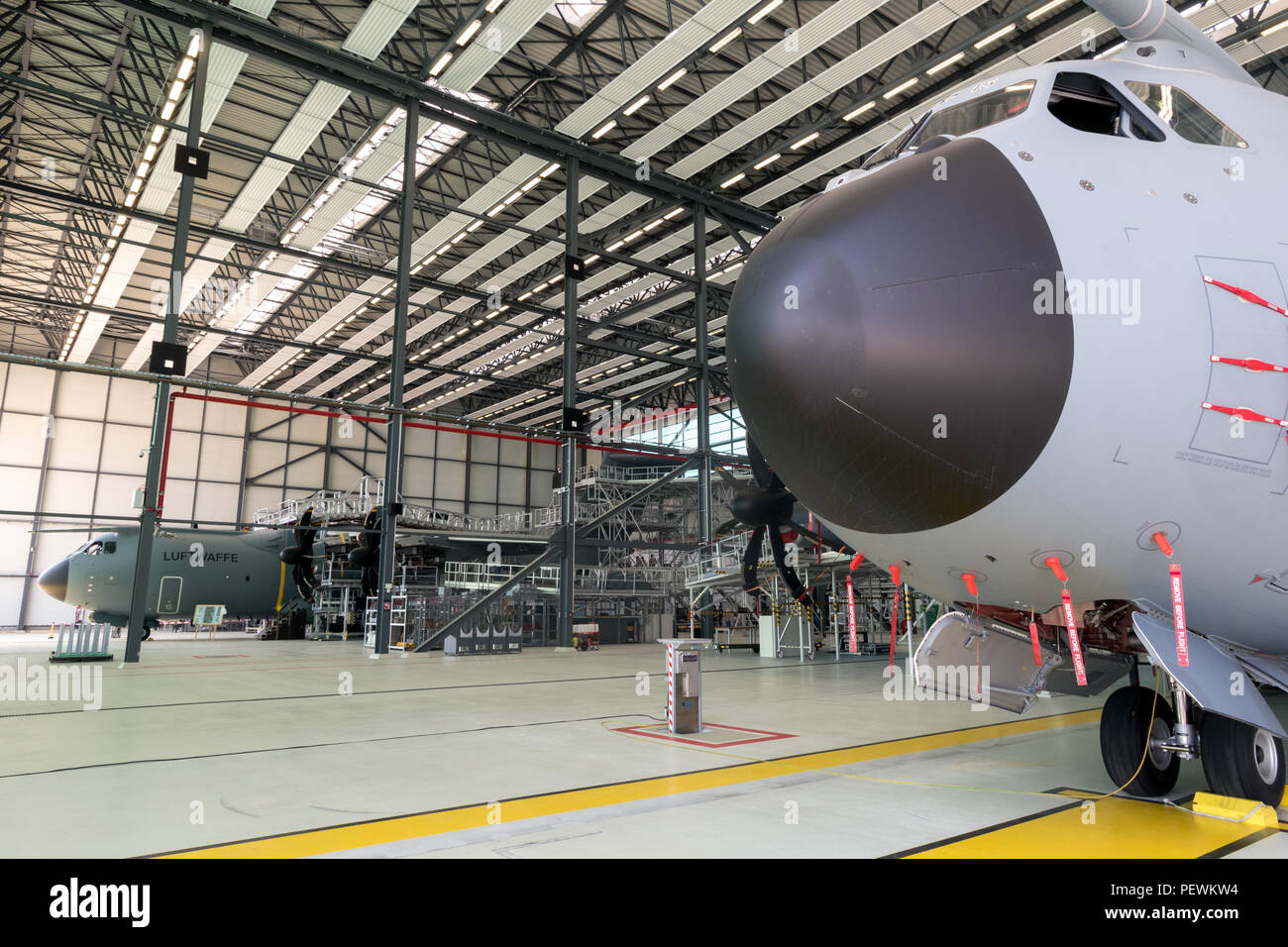 WUNSTORF, GERMANY - JUNE 9, 2018: German Air Force Luftwaffe Airbus A400M military transport planes in a hangar at it`s homebase Wunstorf airbase. Stock Photo